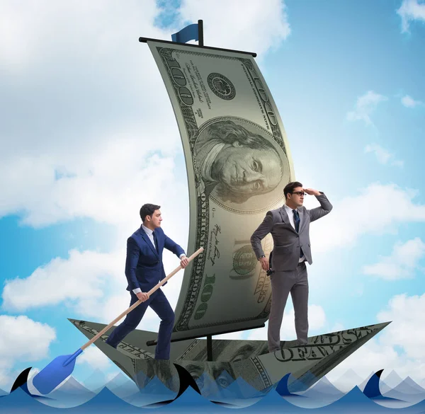 Zakenman roeien op dollarboot in business financieel concept — Stockfoto