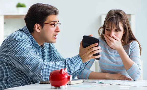 Young couple looking at family finance papers — Stock Photo, Image