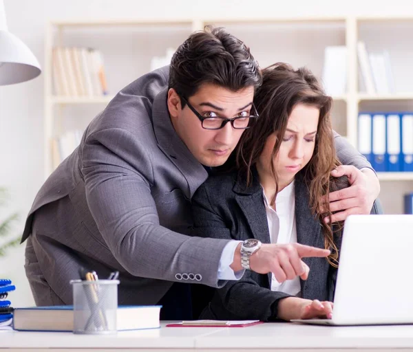 Sexual harassment concept with man and woman in office — Stock Photo, Image