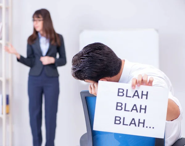 The employee bored at the business presentation