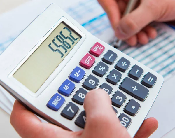 Finance analyst looking and financial reports — Stock Photo, Image