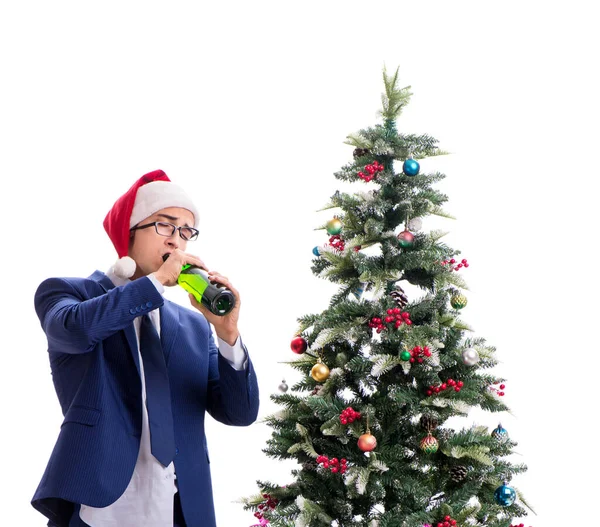 Affärsman dekorera julgran isolerad på vit — Stockfoto