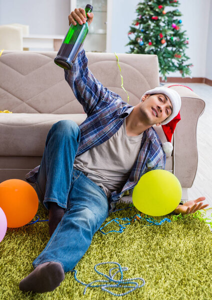Man having hangover after christmas party