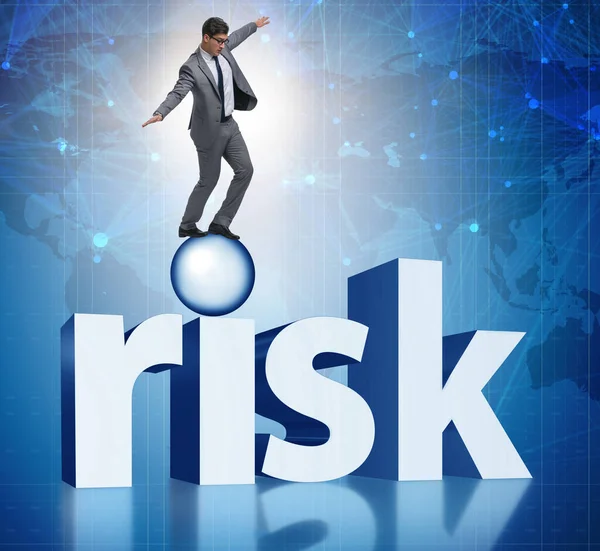 Young businessman in business risk and uncertainty concept — Stock Photo, Image