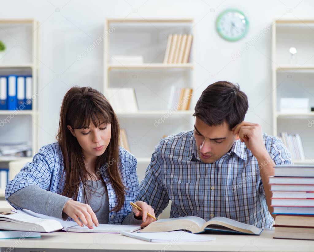 Students sitting and studying in classroom college