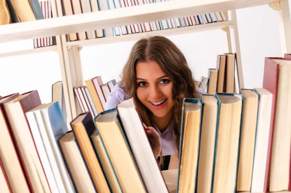 Young female student preparing for exams at library — Stock Photo, Image