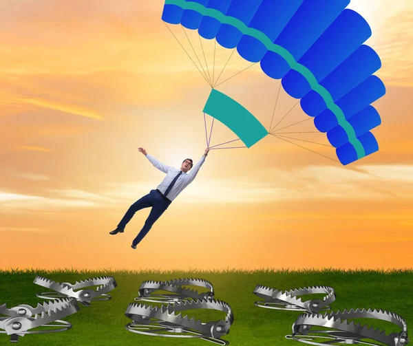 Empresário caindo em armadilha em paraquedas — Fotografia de Stock
