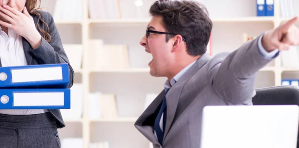 Angry boss unhappy with female employee performance