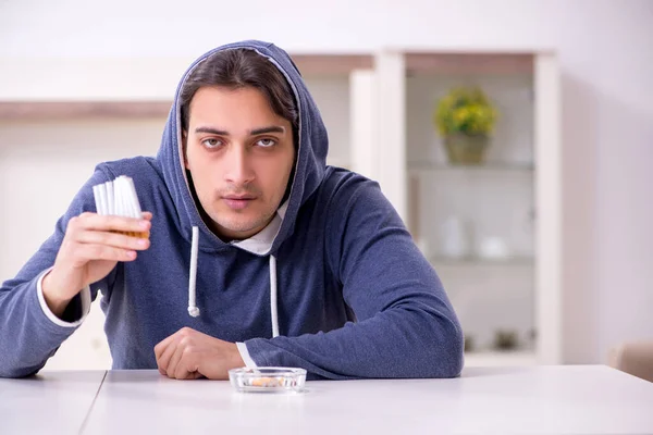 Young man having problems with narcotics at home — Stock Photo, Image