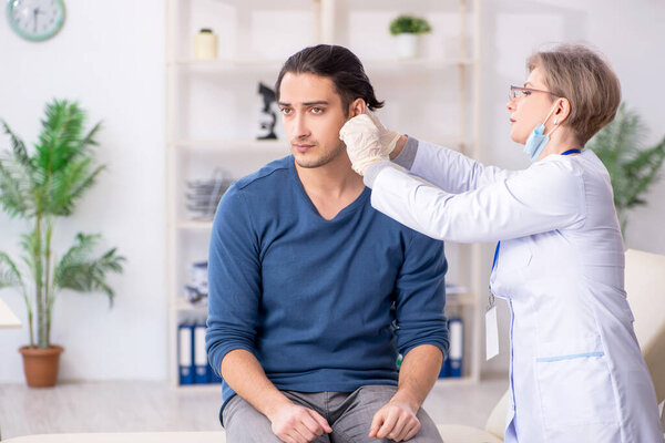 Young patient visiting doctor in hospital