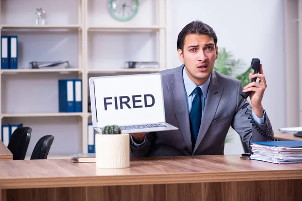 Young male employee being fired from his work — Stock Photo, Image