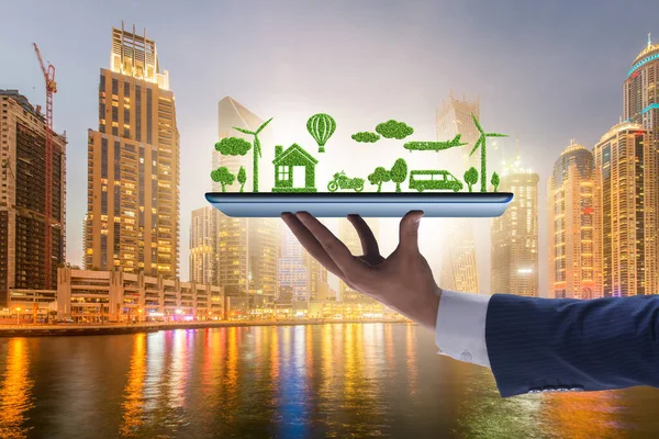 Hand holding tablet with mini ecosystem and clean energy — Stock Photo, Image