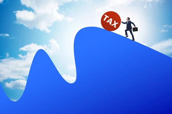 Businessman in tax concept on mountain — Stock Photo, Image