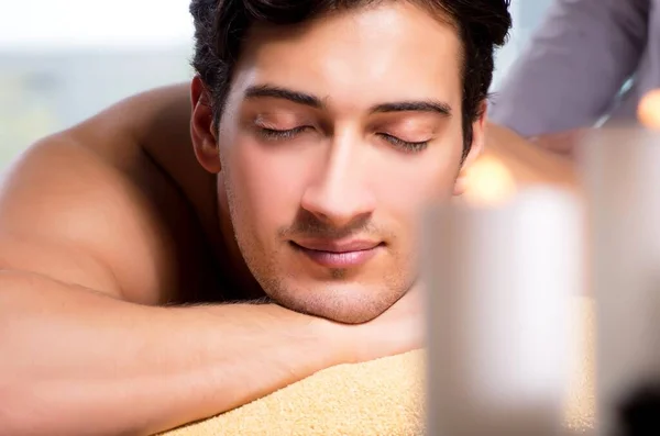 Young handsome man during spa procedure — Stock Photo, Image