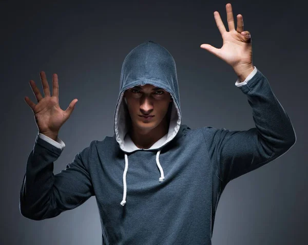 The young man wearing hoodie pressing virtual buttons — Stock Photo, Image