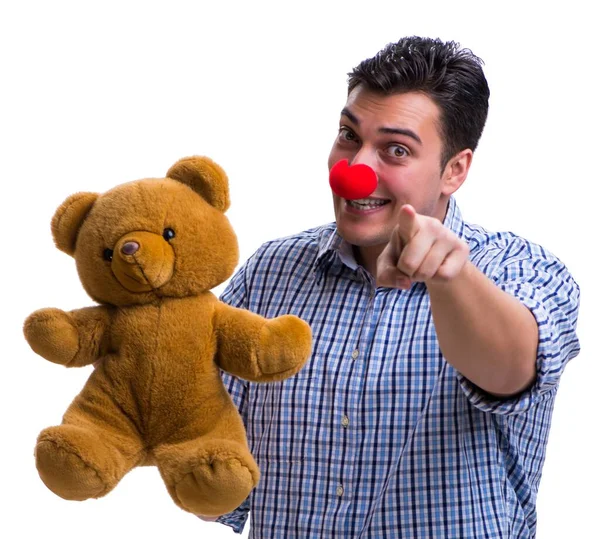 Lustige Clown-Mann mit einem weichen Teddybär Spielzeug isoliert auf weißen Bac — Stockfoto