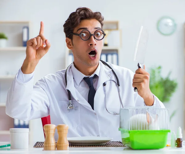 Mad crazy doctor preparing to eat rabbit — Stock Photo, Image