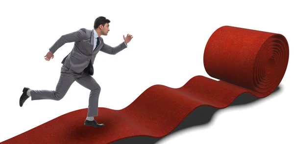 Empresario sobre alfombra roja aislado fondo blanco — Foto de Stock