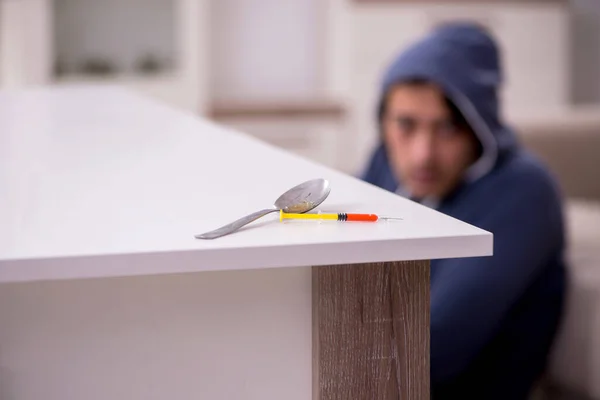 Young man having problems with narcotics at home — Stock Photo, Image