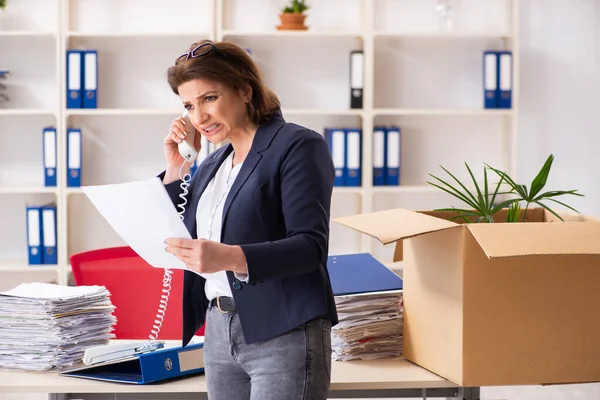 Middle-aged female employee being fired from her work