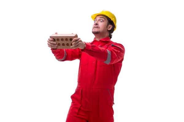 Jovem pedreiro masculino com tijolo isolado em branco — Fotografia de Stock