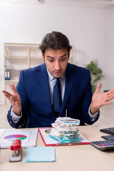 Young male financial manager in the office — Stock Photo, Image