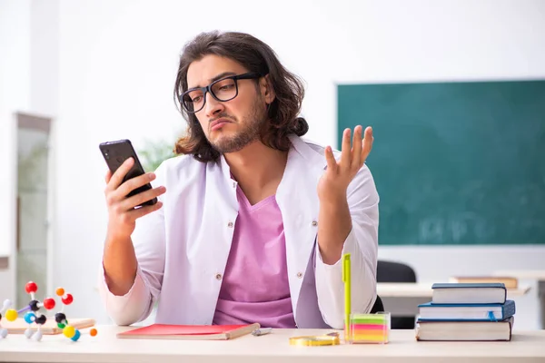 Young male physicist in the classroom — Stock Photo, Image