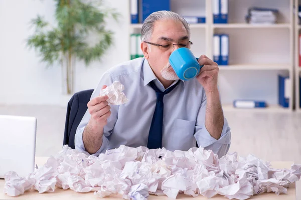 Old businessman rejecting new ideas with lots of papers — Stock Photo, Image