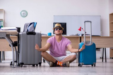 Young male employee preparing for the trip clipart