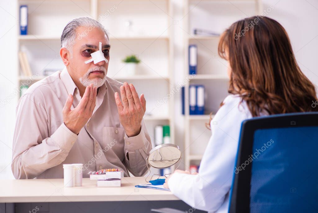 Old man visiting young female doctor for plastic surgery