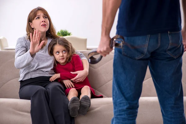 Young couple and their daughter in family conflict concept — Stock Photo, Image