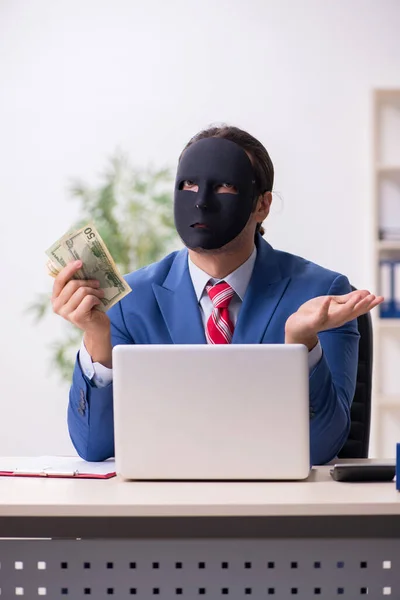 Male employee with mask in hipocrisy concept — Stock Photo, Image