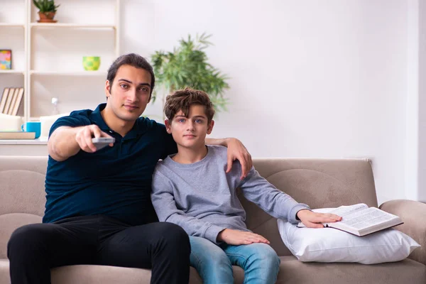 Father and son in exam preparation concept