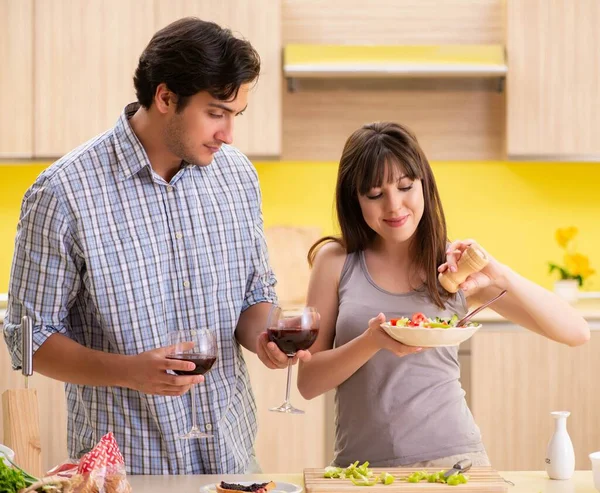 Young couple celebrating wedding anniversary at kitchen Stock Photo