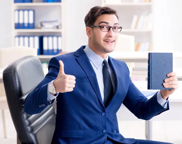 Businessman in executive education concept with book — Stock Photo, Image