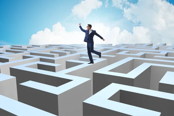 Businessman trying to escape from maze — Stock Photo, Image