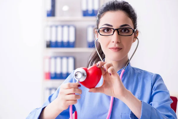 Young female doctor working in the clinic — Stock Photo, Image