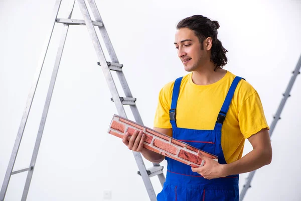 Young man contractor doing renovation at home