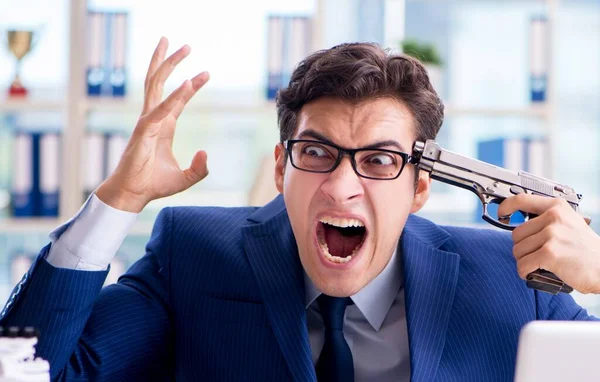 Stressed businessman thinking of suicide due to excessive worklo — Stock Photo, Image