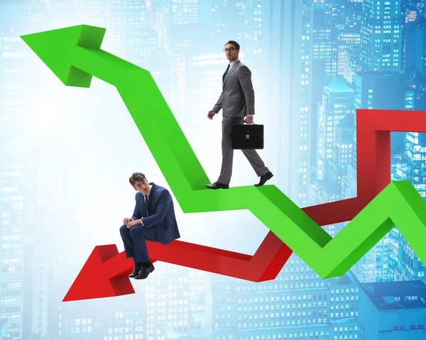 Businessman with charts of growth and decline — Stock Photo, Image