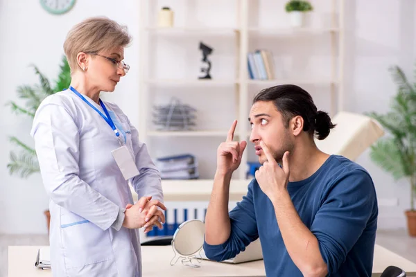 Young patient visiting doctor in hospital