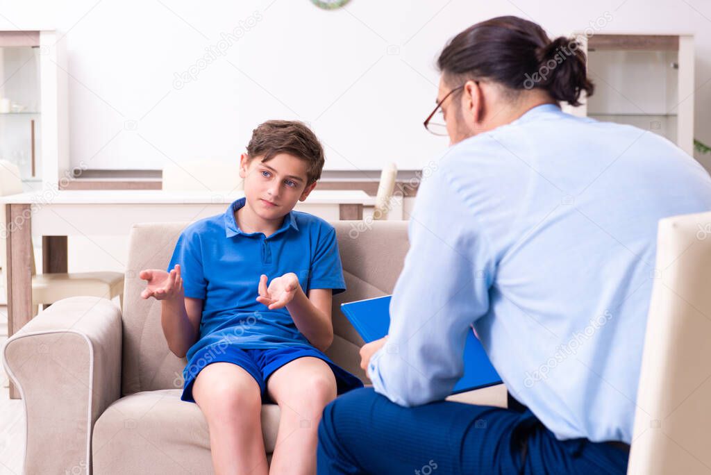 Internet addicted boy visiting male doctor