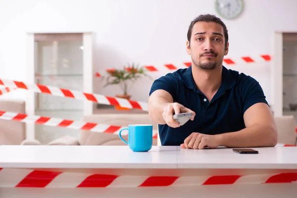 Young man at home in self-isolation concept — Stock Photo, Image