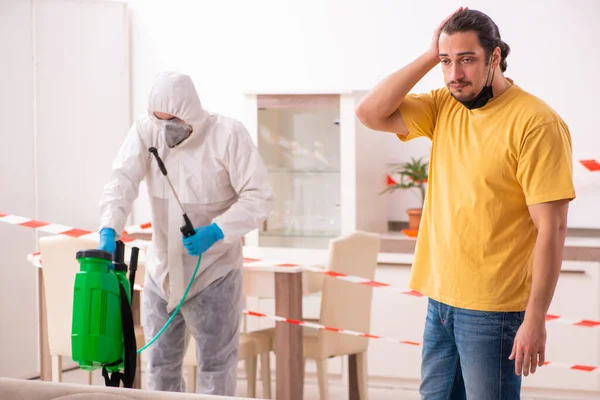 Sanitizer and young man indoors in disinfection concept