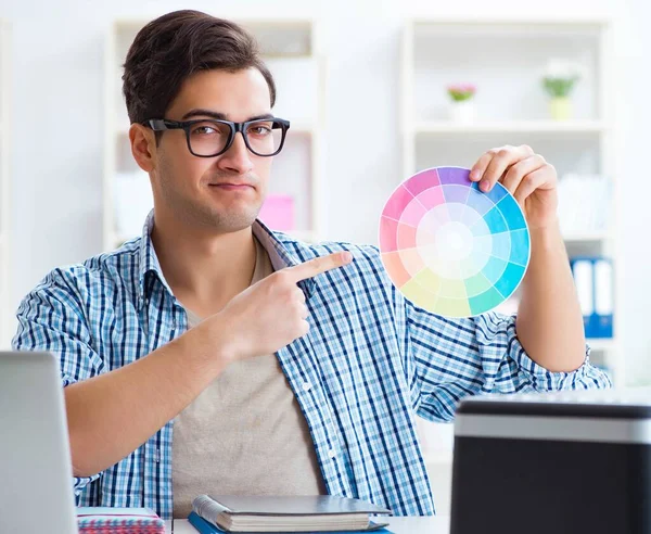Young designer choosing colours for new project — Stock Photo, Image