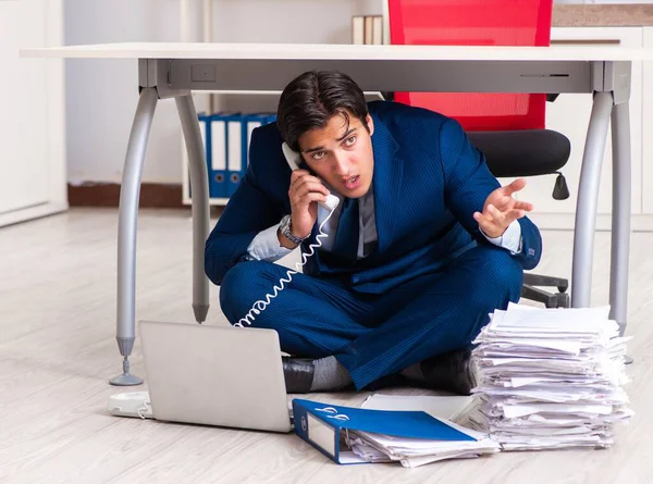 Tired exhausted businessman working overtime in office — Stock Photo, Image