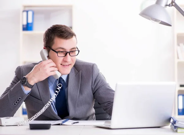 Businessman employee talking on the office phone — Stock Photo, Image