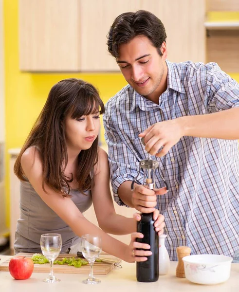 Young couple celebrating wedding anniversary at kitchen — Stock Photo, Image