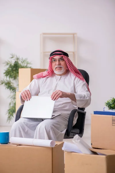 Old arab businessman in office relocation concept
