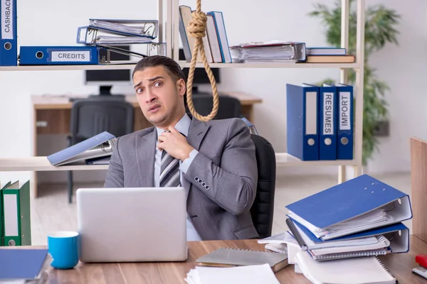 Young male employee committing suicide at workplace — Stock Photo, Image